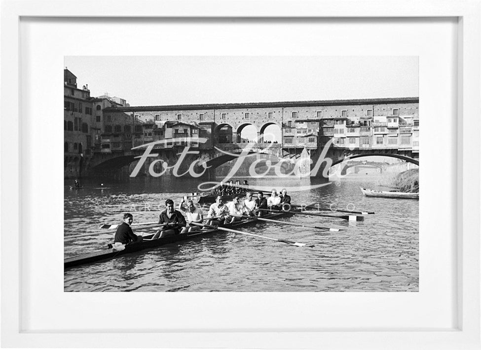 Rowers in Arno with view of Ponte Vecchio