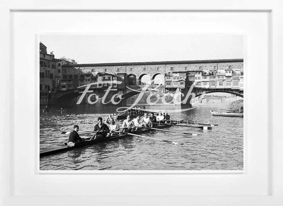 Rowers in Arno with view of Ponte Vecchio