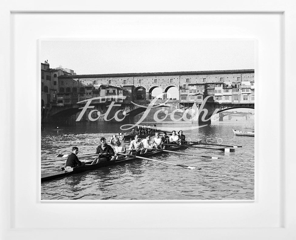 Rowers in Arno with view of Ponte Vecchio