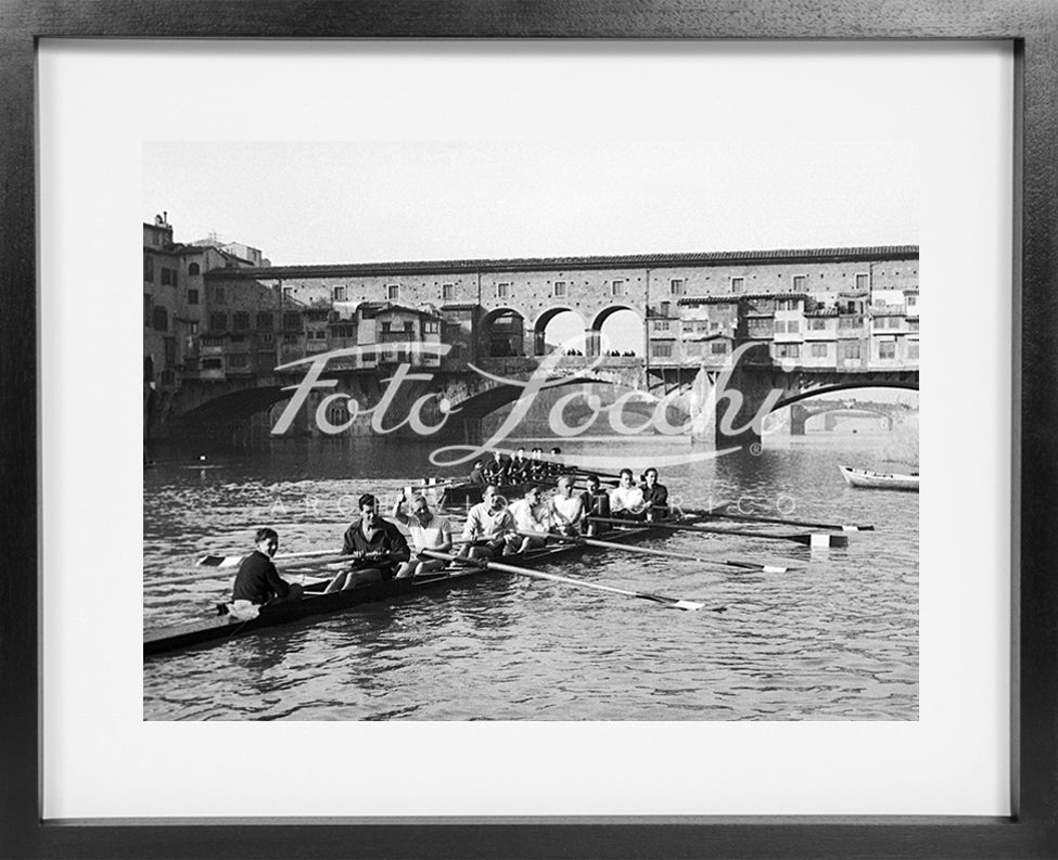 Rowers in Arno with view of Ponte Vecchio