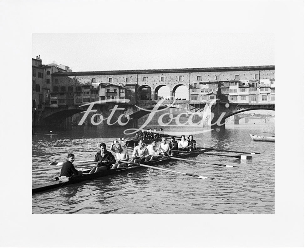 Rowers in Arno with view of Ponte Vecchio