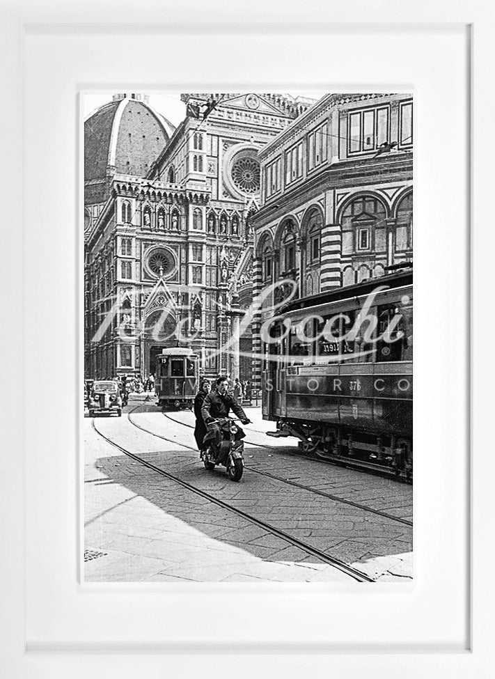 Lambretta and tram in Piazza del Duomo
