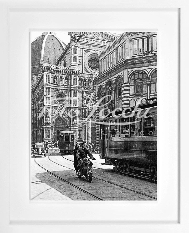 Lambretta and tram in Piazza del Duomo