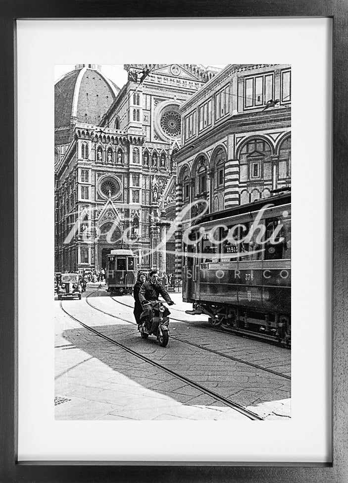 Lambretta and tram in Piazza del Duomo