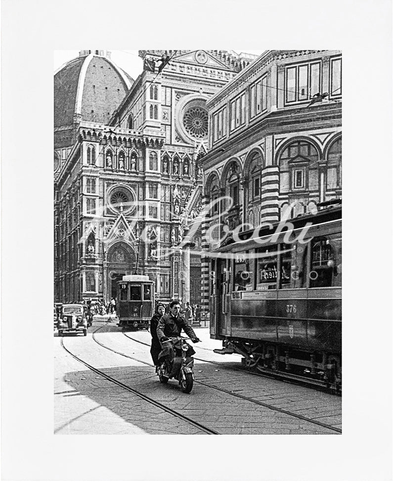 Lambretta and tram in Piazza del Duomo